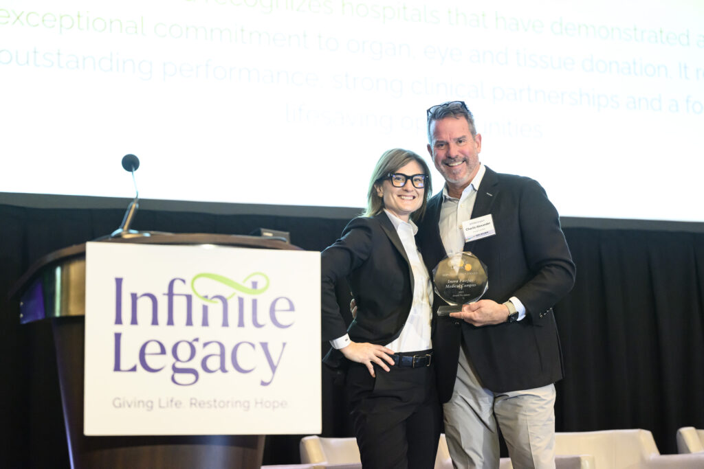 President and Chief Executive Officer, Charlie Alexander stands with Senior Director, Hospital Services & Organ Family Services, Emily Cullen at Infinite Legacy's 2025 Synergy Conference.