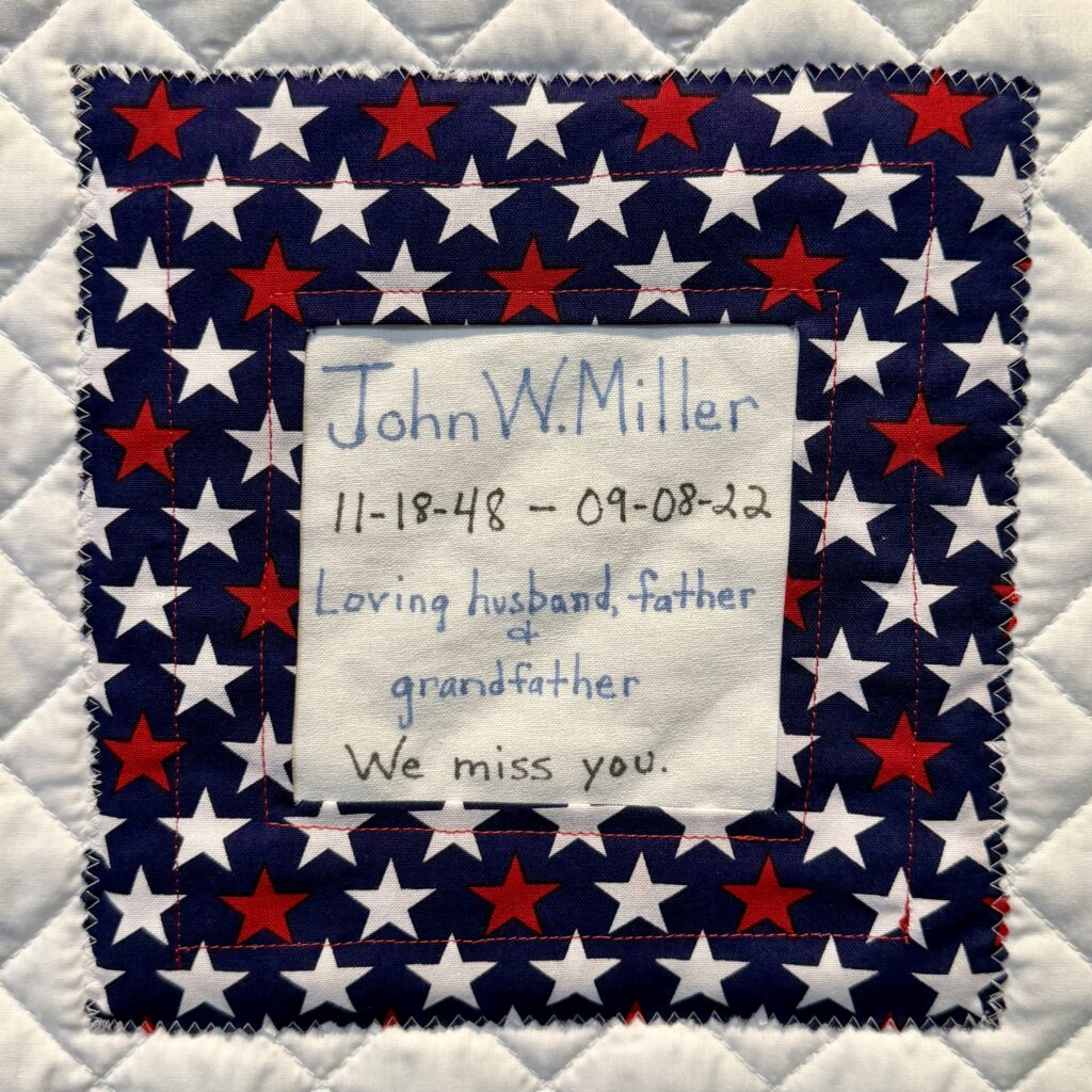 A handmade memorial quilt square dedicated to John W. Miller at Infinite Legacy's Annual Ceremony of Remembrance to honor his legacy as a donor.