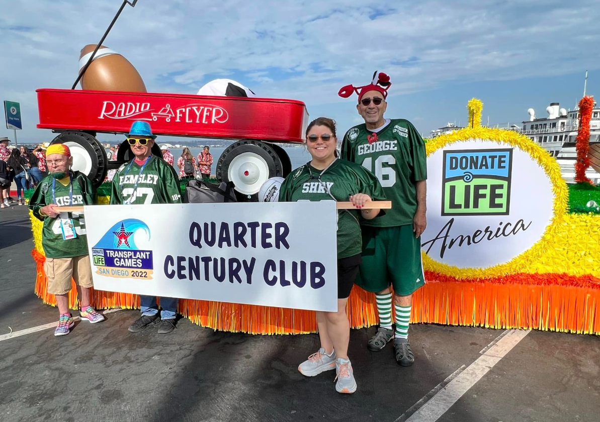 George walks with the Quarter Century Clubs parade float at the 2022 Transplant Games of America in San Diego.