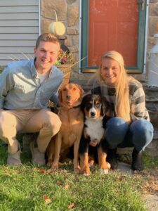 Heart recipient and Donate Life advocate Brandon Kerrigan smiles with his wife, Maddie, and two dogs, Wrigley and Lacey.