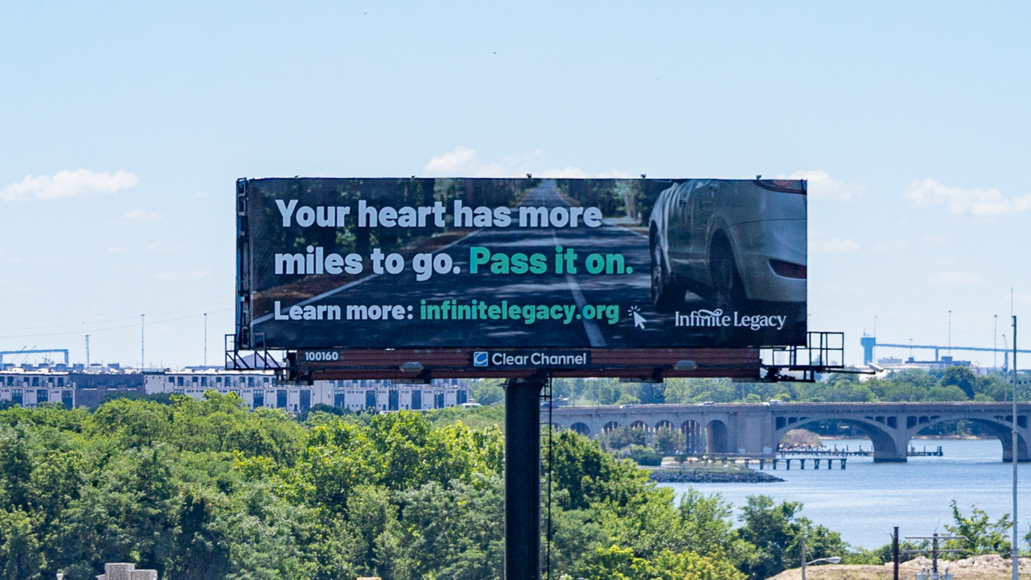 Roadside billboard: 'Your heart has more miles to go. Pass it on.' Learn more: infinitelegacy.org.